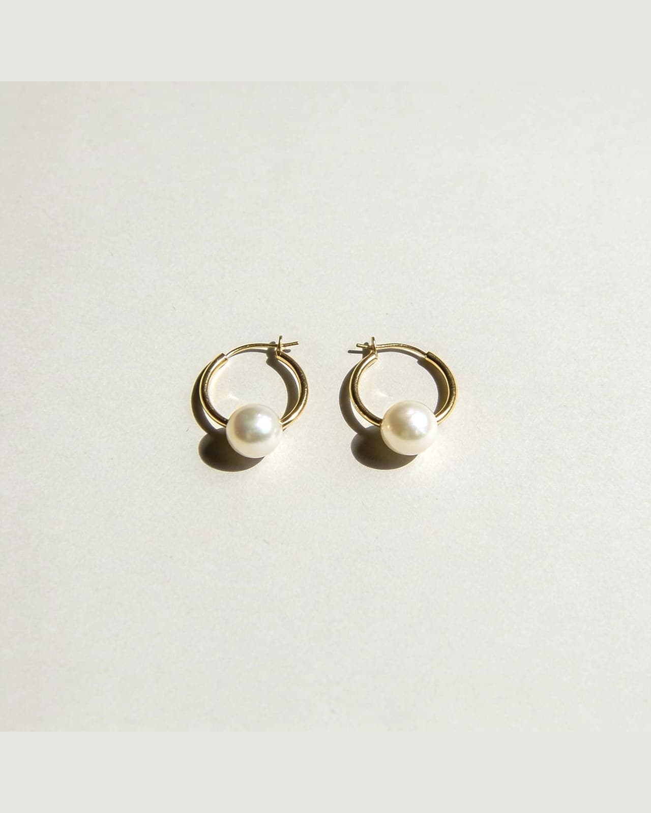 Tremezzo Pearl Earrings · Gold and pearl